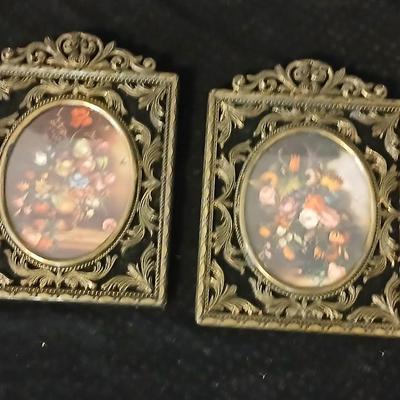 Framed print of the painting "The Hidden Gazebo" by Thomas Kinkade - Two ornate brass picture frames featuring a floral still...