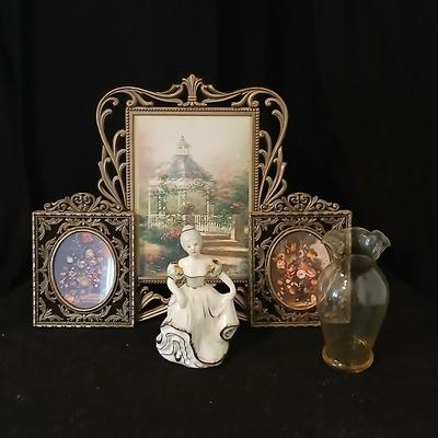 Framed print of the painting "The Hidden Gazebo" by Thomas Kinkade - Two ornate brass picture frames featuring a floral still...