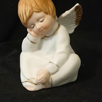 Two angel musical figures - and two small Enesco pocelain figures