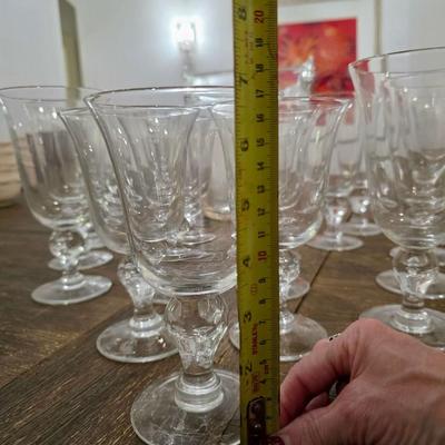 Sale Photo Thumbnail #114: This is a lot including a glass ice bucket and 19 goblets, 2 different sizes. Please see measurements in pictures. The art you may see in the background is NOT included. You are bidding on the lot meaning you must pay for and take the entire lot.