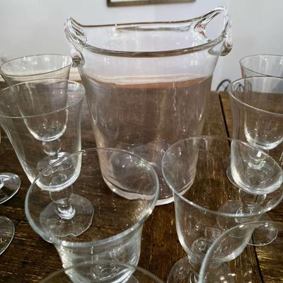 Sale Photo Thumbnail #111: This is a lot including a glass ice bucket and 19 goblets, 2 different sizes. Please see measurements in pictures. The art you may see in the background is NOT included. You are bidding on the lot meaning you must pay for and take the entire lot.