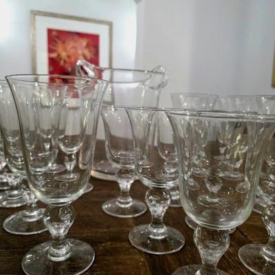 Sale Photo Thumbnail #110: This is a lot including a glass ice bucket and 19 goblets, 2 different sizes. Please see measurements in pictures. The art you may see in the background is NOT included. You are bidding on the lot meaning you must pay for and take the entire lot.