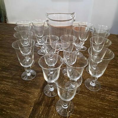 Sale Photo Thumbnail #107: This is a lot including a glass ice bucket and 19 goblets, 2 different sizes. Please see measurements in pictures. The art you may see in the background is NOT included. You are bidding on the lot meaning you must pay for and take the entire lot.