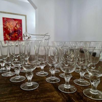 Sale Photo Thumbnail #108: This is a lot including a glass ice bucket and 19 goblets, 2 different sizes. Please see measurements in pictures. The art you may see in the background is NOT included. You are bidding on the lot meaning you must pay for and take the entire lot.