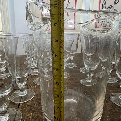 Sale Photo Thumbnail #115: This is a lot including a glass ice bucket and 19 goblets, 2 different sizes. Please see measurements in pictures. The art you may see in the background is NOT included. You are bidding on the lot meaning you must pay for and take the entire lot.