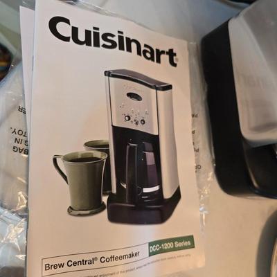 Brand new Cusinart coffee maker with a collection of mugs - including two insulated mugs and a turntable / lazy Susan