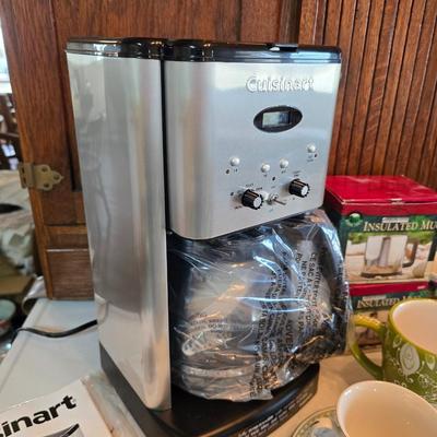 Brand new Cusinart coffee maker with a collection of mugs - including two insulated mugs and a turntable / lazy Susan