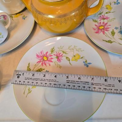 Tea time! Lillian Vernon tea pot - with other tea pots and a set of mid-century demitasse cup and saucer set with a floral pattern.