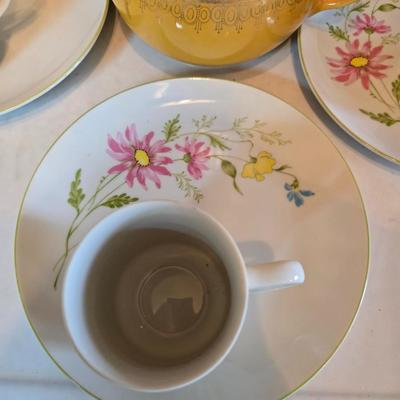 Tea time! Lillian Vernon tea pot - with other tea pots and a set of mid-century demitasse cup and saucer set with a floral pattern.