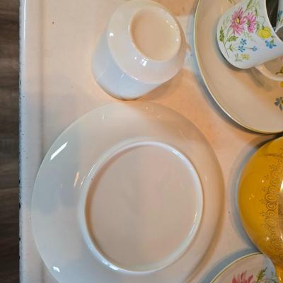 Tea time! Lillian Vernon tea pot - with other tea pots and a set of mid-century demitasse cup and saucer set with a floral pattern.