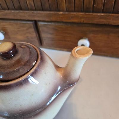 Tea time! Lillian Vernon tea pot - with other tea pots and a set of mid-century demitasse cup and saucer set with a floral pattern.