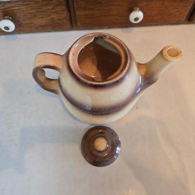 Tea time! Lillian Vernon tea pot - with other tea pots and a set of mid-century demitasse cup and saucer set with a floral pattern.