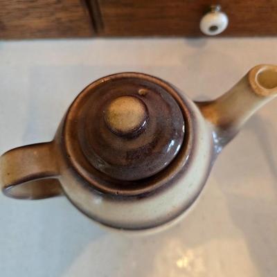 Tea time! Lillian Vernon tea pot - with other tea pots and a set of mid-century demitasse cup and saucer set with a floral pattern.