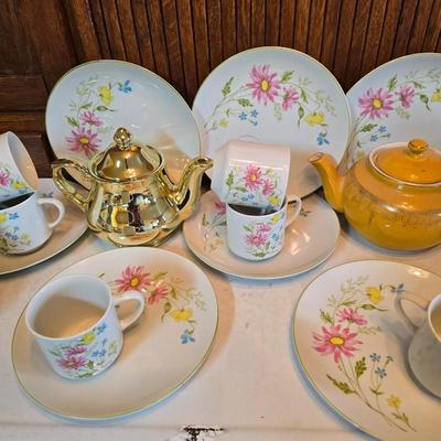 Tea time! Lillian Vernon tea pot - with other tea pots and a set of mid-century demitasse cup and saucer set with a floral pattern.