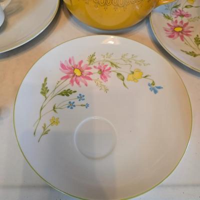 Tea time! Lillian Vernon tea pot - with other tea pots and a set of mid-century demitasse cup and saucer set with a floral pattern.