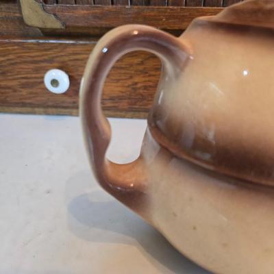 Tea time! Lillian Vernon tea pot - with other tea pots and a set of mid-century demitasse cup and saucer set with a floral pattern.