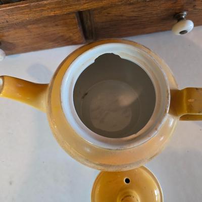 Tea time! Lillian Vernon tea pot - with other tea pots and a set of mid-century demitasse cup and saucer set with a floral pattern.