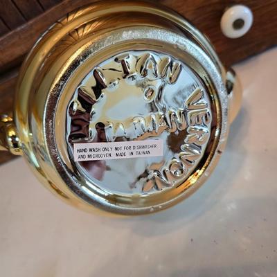 Tea time! Lillian Vernon tea pot - with other tea pots and a set of mid-century demitasse cup and saucer set with a floral pattern.