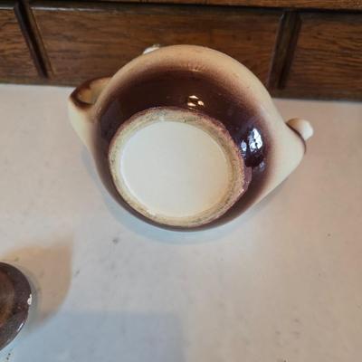 Tea time! Lillian Vernon tea pot - with other tea pots and a set of mid-century demitasse cup and saucer set with a floral pattern.