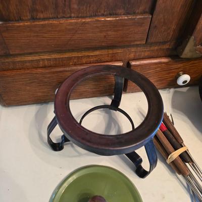 vintage, mid-century modern avocado green fondue pots - orange fondue pot - and a retro General Electric (GE) electric skillet.