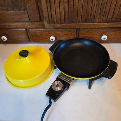 vintage, mid-century modern avocado green fondue pots - orange fondue pot - and a retro General Electric (GE) electric skillet.