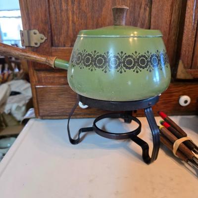 vintage, mid-century modern avocado green fondue pots - orange fondue pot - and a retro General Electric (GE) electric skillet.