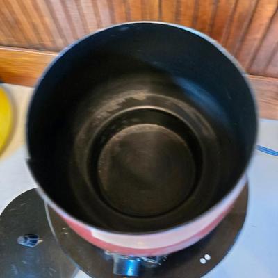 vintage, mid-century modern avocado green fondue pots - orange fondue pot - and a retro General Electric (GE) electric skillet.