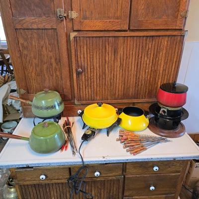 vintage, mid-century modern avocado green fondue pots - orange fondue pot - and a retro General Electric (GE) electric skillet.