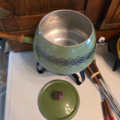 vintage, mid-century modern avocado green fondue pots - orange fondue pot - and a retro General Electric (GE) electric skillet.