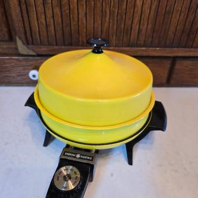 vintage, mid-century modern avocado green fondue pots - orange fondue pot - and a retro General Electric (GE) electric skillet.