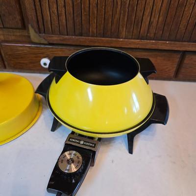 vintage, mid-century modern avocado green fondue pots - orange fondue pot - and a retro General Electric (GE) electric skillet.