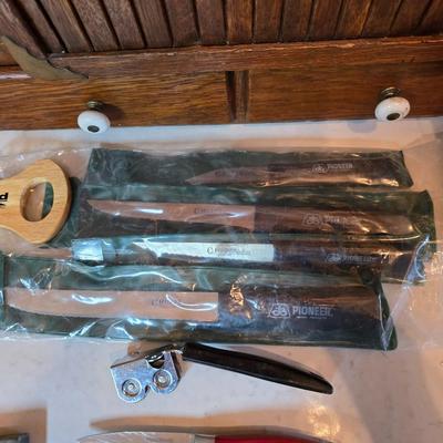 Kitchen knives - including new set of Pioneer branded Chuppa knives - sharpening stone and tools and a cutting board