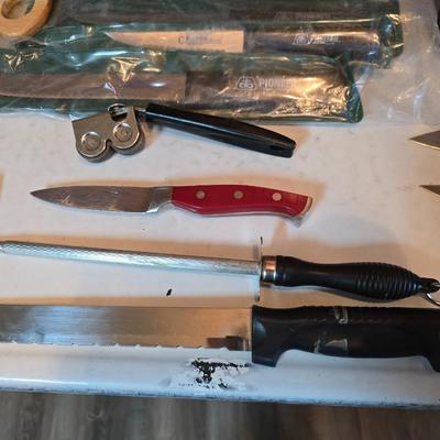 Kitchen knives - including new set of Pioneer branded Chuppa knives - sharpening stone and tools and a cutting board