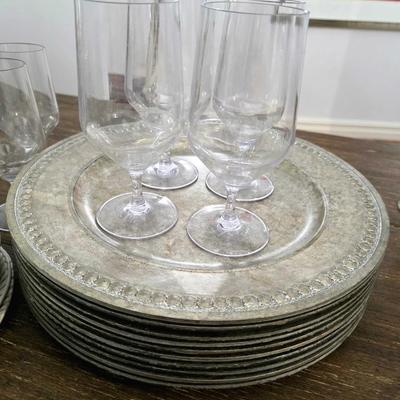 Sale Photo Thumbnail #117: This is a lot including cream colored melamine plates, acrylic silver vintage look chargers, and clear acrylic goblets. This is a lot meaning you must pay for and take the entire lot.