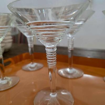 Sale Photo Thumbnail #122: This is a lot including 6 glass martini glasses and 2 trays by Georges Briard Designs. One tray does have some scuffs. Please see pictures for close inspection. The art you may see in the background is NOT included. You are bidding on the lot meaning you 