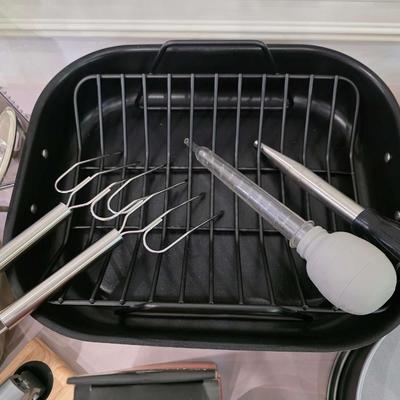 Sale Photo Thumbnail #137: Just in time for the holidays! This is a lot of various roasting and baking items including an All-Clad roasting pan and an electric Cuisinart carving knife. You are bidding on the lot meaning you must pay for and take the entire lot.