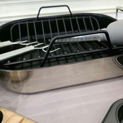 Sale Photo Thumbnail #139: Just in time for the holidays! This is a lot of various roasting and baking items including an All-Clad roasting pan and an electric Cuisinart carving knife. You are bidding on the lot meaning you must pay for and take the entire lot.