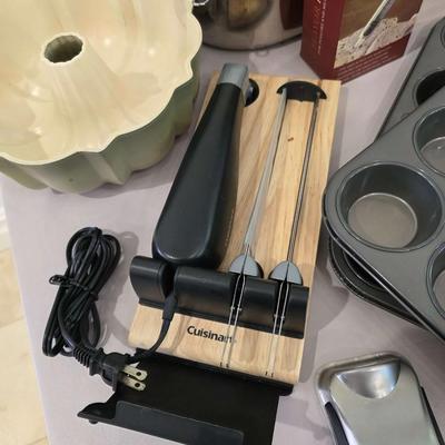Sale Photo Thumbnail #134: Just in time for the holidays! This is a lot of various roasting and baking items including an All-Clad roasting pan and an electric Cuisinart carving knife. You are bidding on the lot meaning you must pay for and take the entire lot.