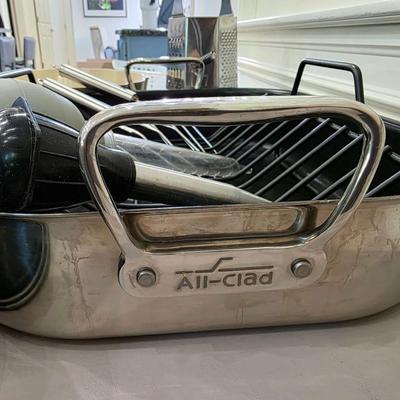 Sale Photo Thumbnail #138: Just in time for the holidays! This is a lot of various roasting and baking items including an All-Clad roasting pan and an electric Cuisinart carving knife. You are bidding on the lot meaning you must pay for and take the entire lot.