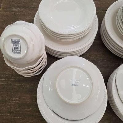 Sale Photo Thumbnail #145: This is a lot including dinner plates and bowls by Pottery Barn, "Emma" pattern with a beaded edge. A few do show signs of wear (light gray lines), but only a few of them. The salad plates and dessert bowls are by Ballard Designs. They are the same white 