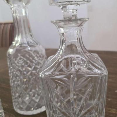 Sale Photo Thumbnail #152: This is a lot including 3 crystal decanters with a hammered silver tray. One decanter is Waterford, one is Gorham and the other is unmarked, No flaws noticed. This is a lot meaning you must pay for and take the entire lot.