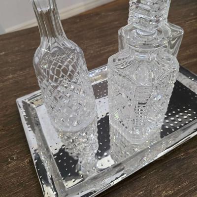 Sale Photo Thumbnail #155: This is a lot including 3 crystal decanters with a hammered silver tray. One decanter is Waterford, one is Gorham and the other is unmarked, No flaws noticed. This is a lot meaning you must pay for and take the entire lot.