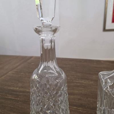 Sale Photo Thumbnail #154: This is a lot including 3 crystal decanters with a hammered silver tray. One decanter is Waterford, one is Gorham and the other is unmarked, No flaws noticed. This is a lot meaning you must pay for and take the entire lot.