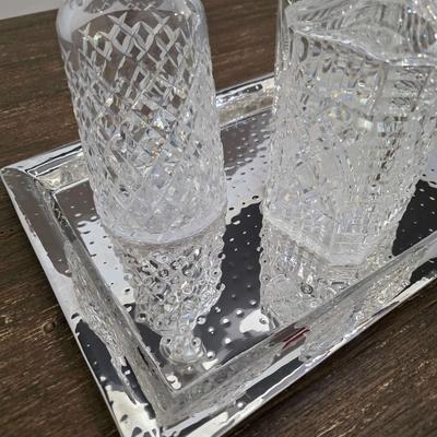 Sale Photo Thumbnail #156: This is a lot including 3 crystal decanters with a hammered silver tray. One decanter is Waterford, one is Gorham and the other is unmarked, No flaws noticed. This is a lot meaning you must pay for and take the entire lot.