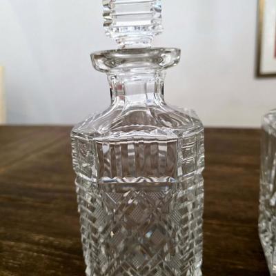 Sale Photo Thumbnail #153: This is a lot including 3 crystal decanters with a hammered silver tray. One decanter is Waterford, one is Gorham and the other is unmarked, No flaws noticed. This is a lot meaning you must pay for and take the entire lot.