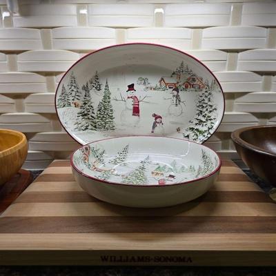 Sale Photo Thumbnail #163: This is a lot including a Williams Sonoma retired Snowman pattern oval platter and serving bowl, a Willams Sonoma cutting board, a light wood bowl, a footed dark wood bowl, and a miscellaneous cutting board. You are bidding on the lot meaning you must pay