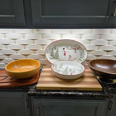 Sale Photo Thumbnail #162: This is a lot including a Williams Sonoma retired Snowman pattern oval platter and serving bowl, a Willams Sonoma cutting board, a light wood bowl, a footed dark wood bowl, and a miscellaneous cutting board. You are bidding on the lot meaning you must pay
