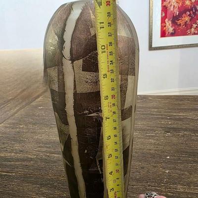 Sale Photo Thumbnail #179: Stunning handmade blown glass art vase in metallics (silver leaf) and browns by Adam Aaronson from his studio in London. This is a timeless glass art piece. It measures 12" tall and is rather heavy. The wall art you may see in the background is NOT includ