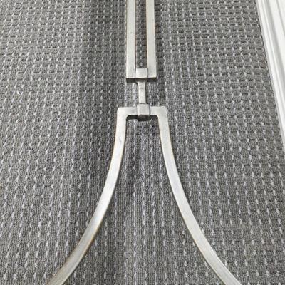 Sale Photo Thumbnail #183: Modern silver iron and glass sofa/entry table in excellent condition. The glass top is clean and clear without scratches. It measures 56"L x 20"D x 30"H.