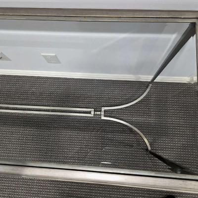 Sale Photo Thumbnail #184: Modern silver iron and glass sofa/entry table in excellent condition. The glass top is clean and clear without scratches. It measures 56"L x 20"D x 30"H.